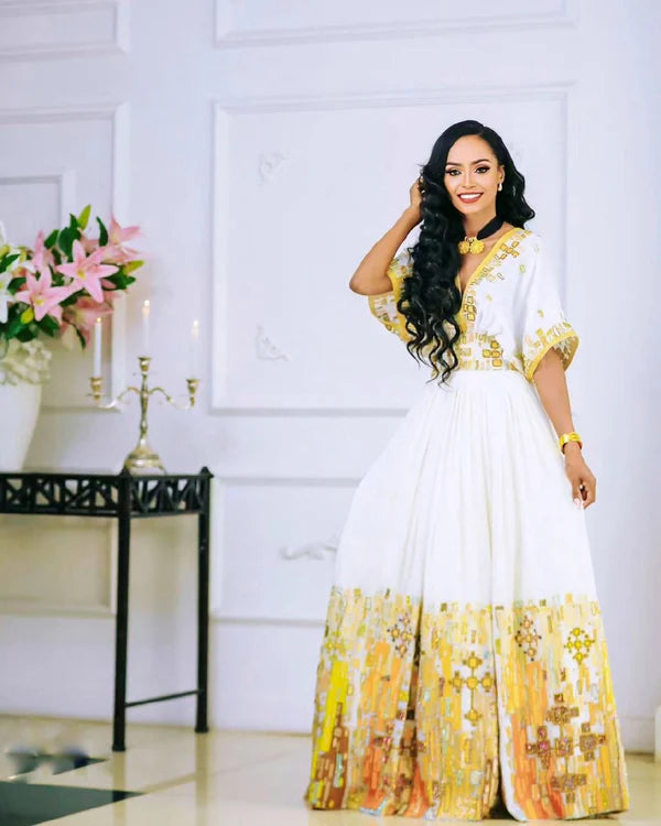 Gorgeous Yellow Habesha Couples Outfit for Traditional Weddings.