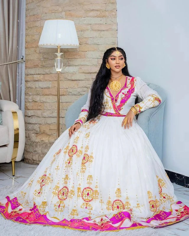Enchanting Habesha wedding dress radiates beauty and elegance with its captivating pink hue