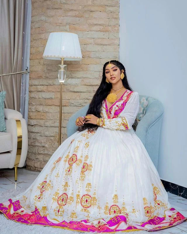 Enchanting Habesha wedding dress radiates beauty and elegance with its captivating pink hue