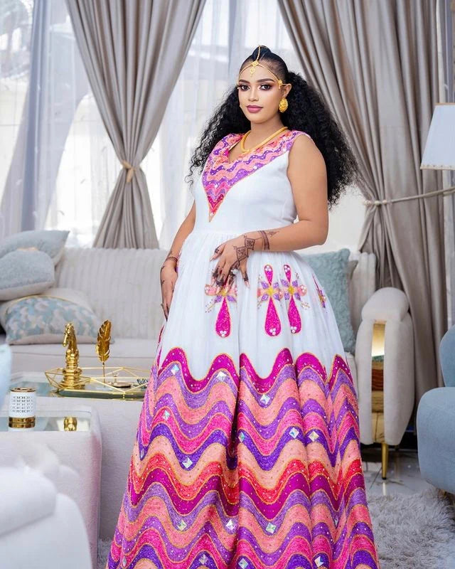 Enchanting Habesha wedding dress radiates vibrant beauty with its array of colors and intricate details