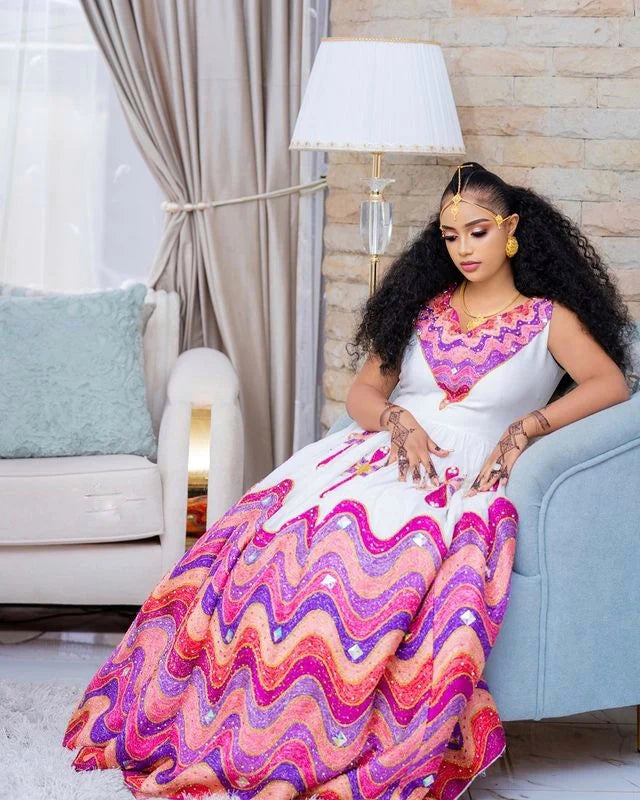 Enchanting Habesha wedding dress radiates vibrant beauty with its array of colors and intricate details