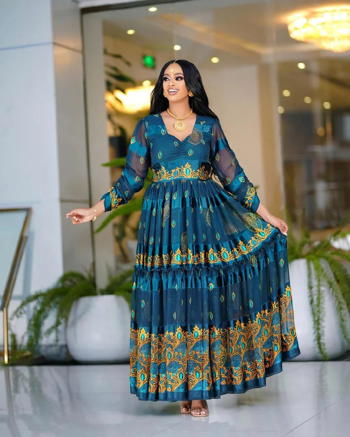 This deeply hued blue chiffon Habesha Kemis is an exquisite example of traditional Ethiopian design, showcasing exceptional craftsmanship and timeless elegance.