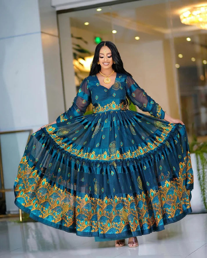 This deeply hued blue chiffon Habesha Kemis is an exquisite example of traditional Ethiopian design, showcasing exceptional craftsmanship and timeless elegance.