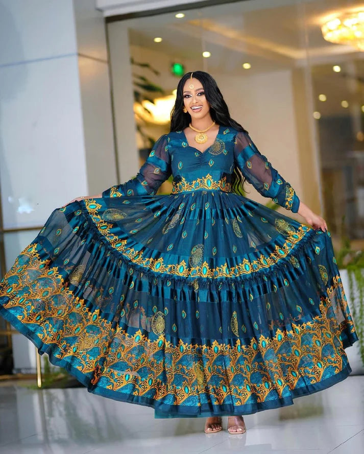 This deeply hued blue chiffon Habesha Kemis is an exquisite example of traditional Ethiopian design, showcasing exceptional craftsmanship and timeless elegance.