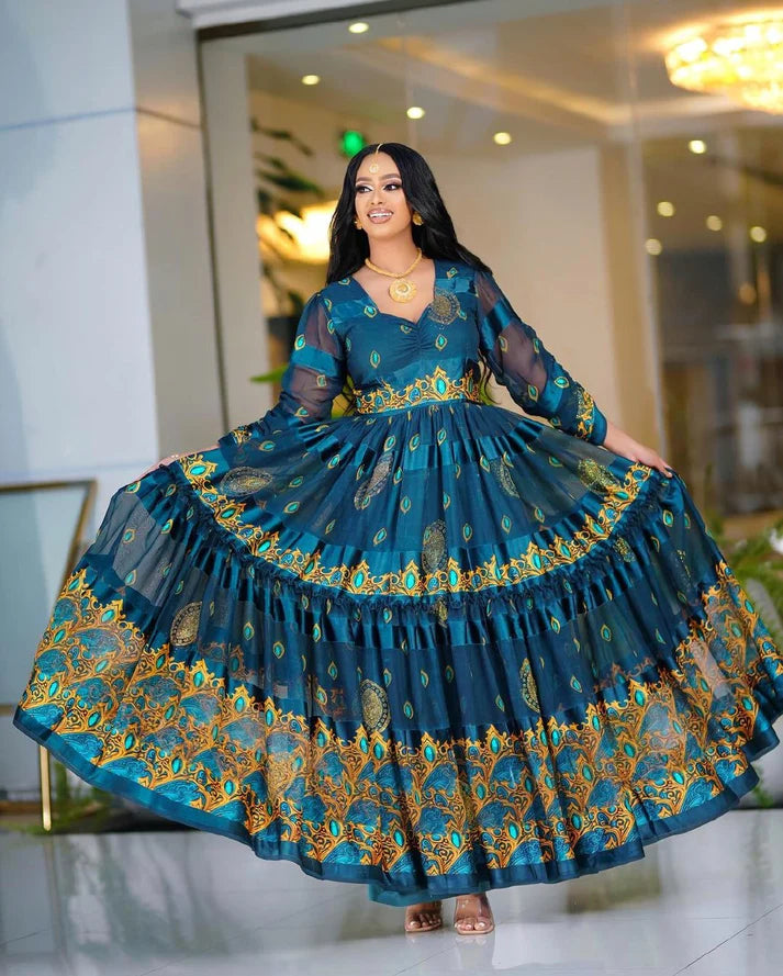 This deeply hued blue chiffon Habesha Kemis is an exquisite example of traditional Ethiopian design, showcasing exceptional craftsmanship and timeless elegance.