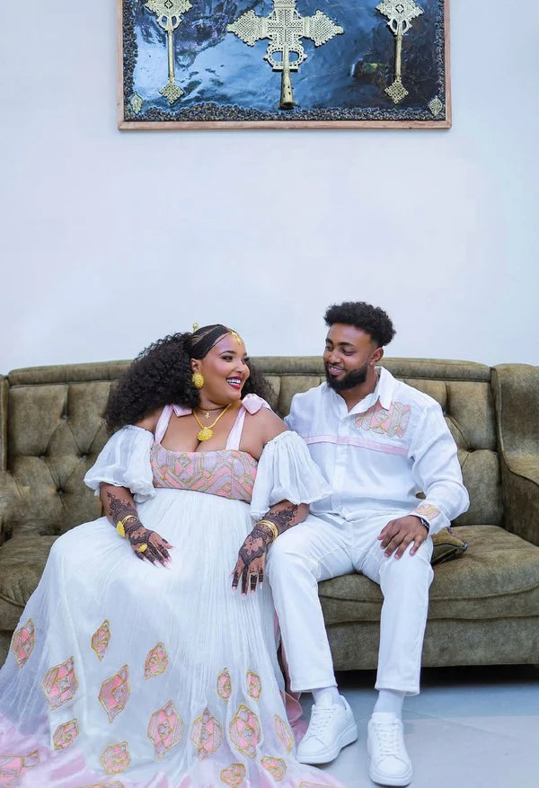 Elegant Light Pink Habesha Couples Outfit with Beautiful Design