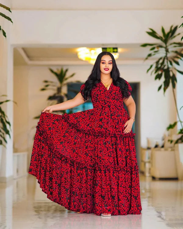 This striking red Habesha dress features elegant black embellishments.