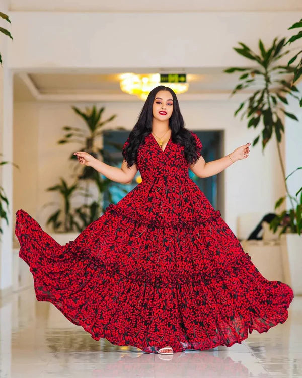 This striking red Habesha dress features elegant black embellishments.