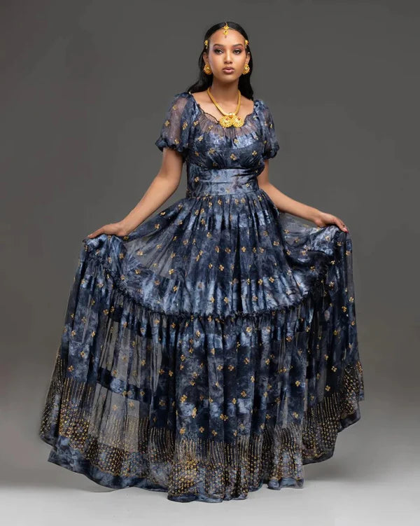 A sophisticated black Habesha chiffon dress adorned with gold accents.
