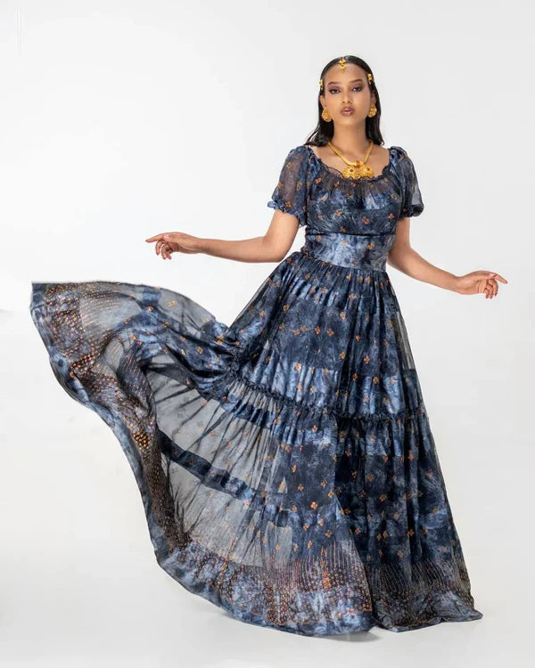 A sophisticated black Habesha chiffon dress adorned with gold accents.