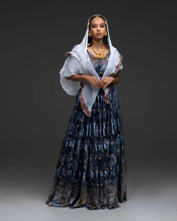 A sophisticated black Habesha chiffon dress adorned with gold accents.