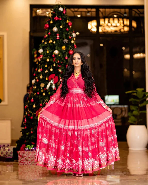 This stunning Habesha chiffon dress features eye-catching embellishments.
