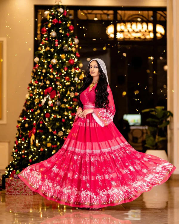 This stunning Habesha chiffon dress features eye-catching embellishments.