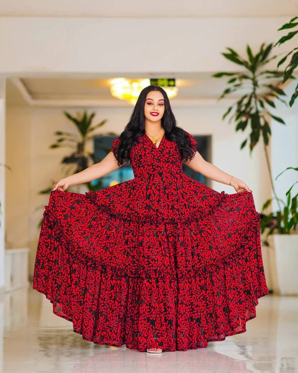 This striking red Habesha dress features elegant black embellishments.