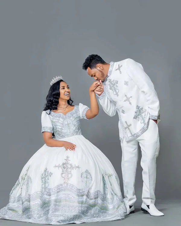 Sophisticated Silver and Blue Habesha Couple's Outfit: Contemporary Matching Wedding Ensemble