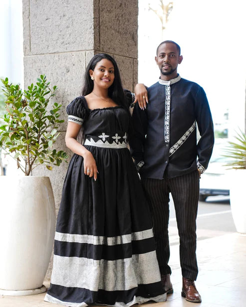 Harmonious Love in Black Matching Habesha Couples Outfit: Featuring Silver Handcrafted Embroidery