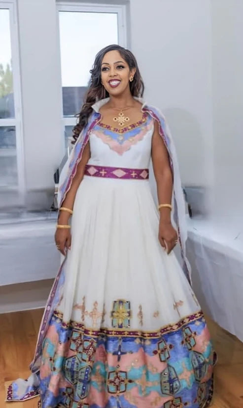 Enchanting Multicolored Habesha Wedding Attire: Intricately Handcrafted Matching Couples Outfit