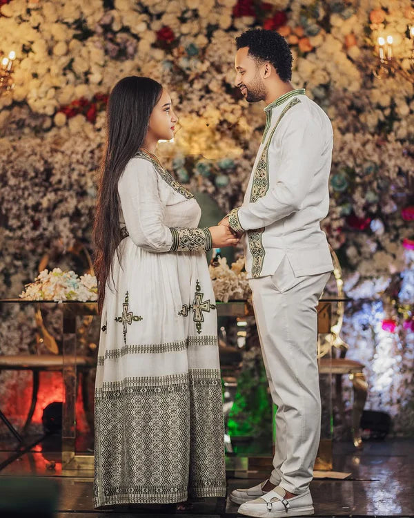 Silvered Elegance with Matching Habesha Couples Outfit: Majestic Wedding Ensemble