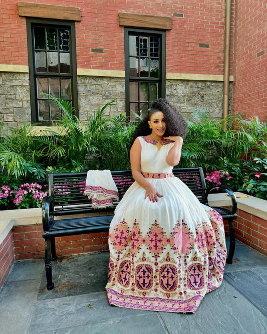 Embrace the Grace of Habesha Attire Pink and Purple Brilliance in a Modern Gown
