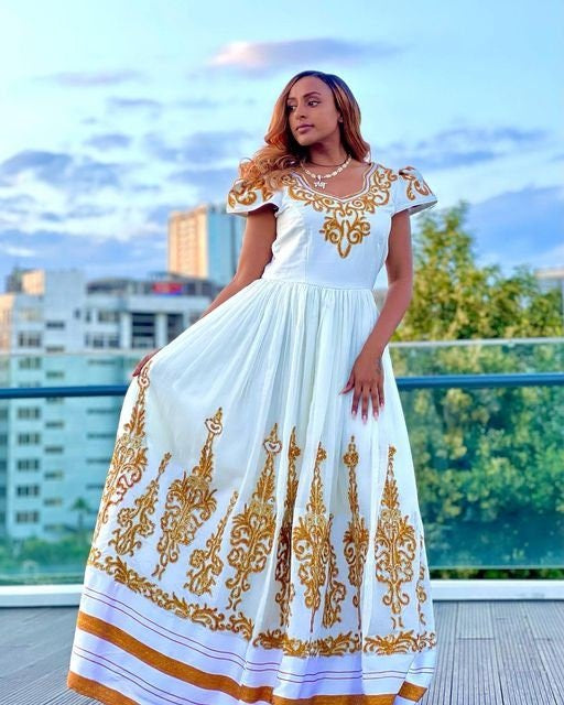 A luxurious full tilf Habesha Wedding kemis crafted from rich Menen fabric