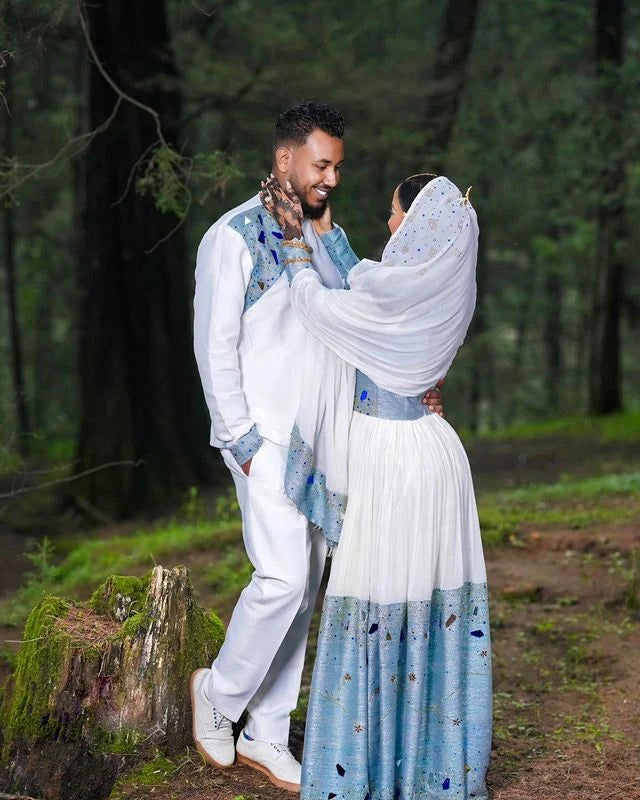 Stunning Blue Habesha Couples Outfit, a vibrant matching ensemble perfect for Wedding