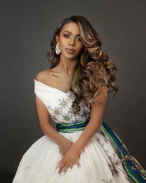 The Royal Menen Wedding Dress A stunning Habesha garment with Tilf embroidery and beads, showcasing cultural artistry