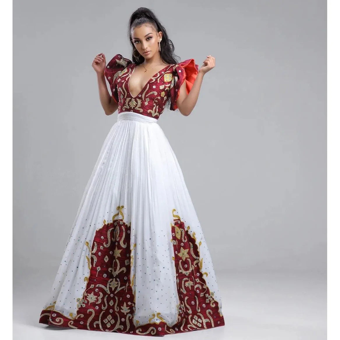 A Habesha Fabric Wedding Kemis with Shimena Top, adorned with beaded accents and a Tilf hem