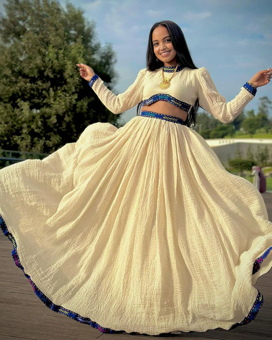 A chic Habesha two-piece stylish crop top and flowing skirt
