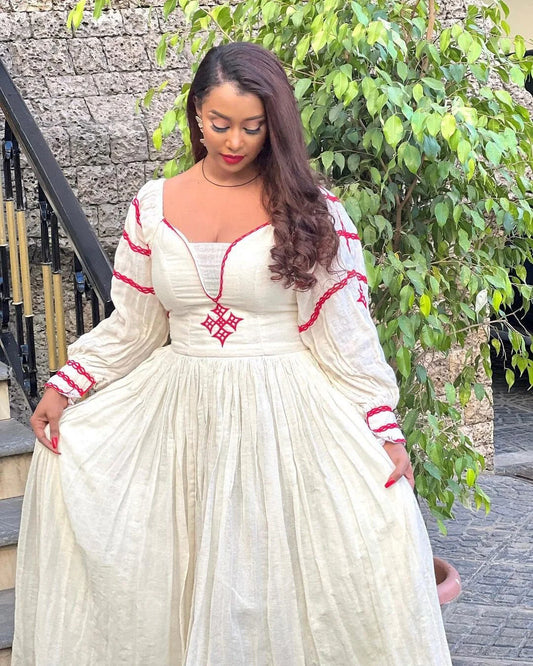 A vibrant Habesha Kemis scarlet tilf design, bold style Energetic, cultural flair