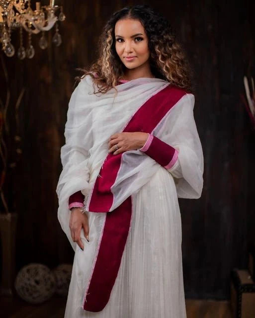 A Vibrant Habesha Kemis with Rich Embroidery and Traditional Attire