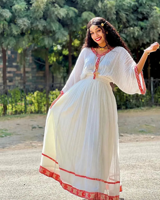 Simplicity in Scarlet Modern Habesha Dress Redefined with Enduring Grace