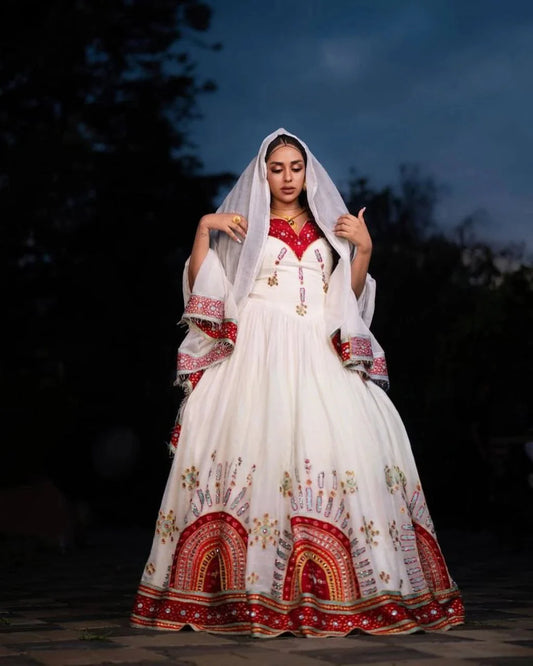 Elegant Habesha Dress with Intricate Embroidery and Vibrant Colors