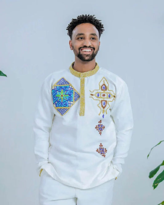 Sapphire Serenade: Ethereal Sparkle in Blue Habesha Couples Wedding Attire.