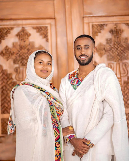 Modern Vibrant Habesha Couples Outfit: Simple Multi-Colored Attire.