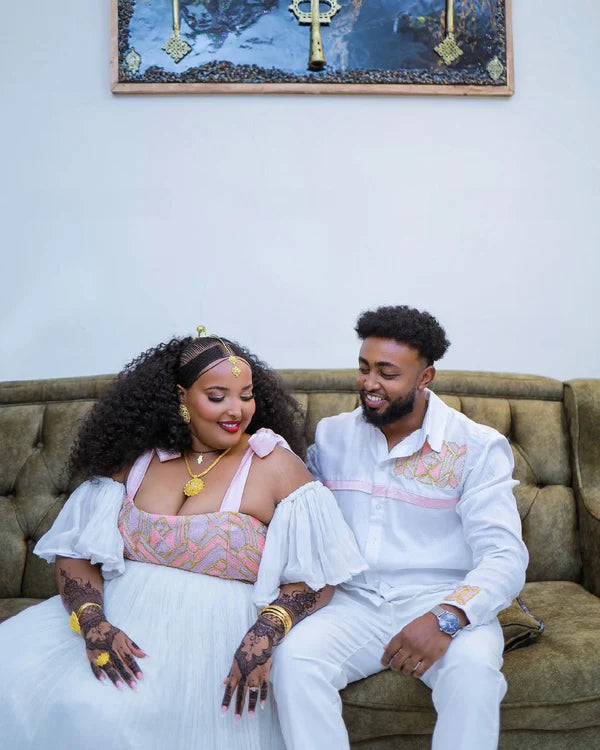 Elegant Light Pink Habesha Couples Outfit with Beautiful Design