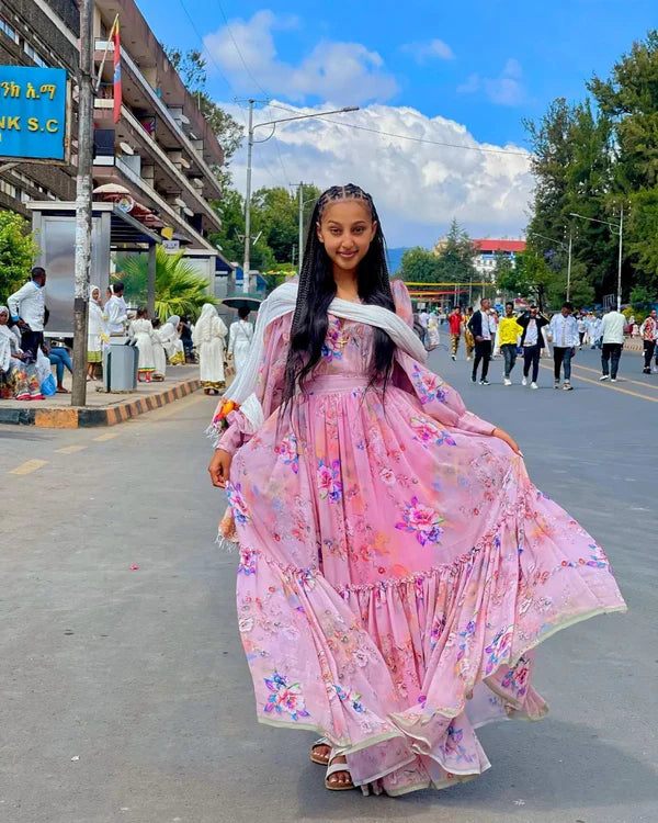 Stunning Sweet Pink Habesha Chiffon Dress: with Colorful Patterns.