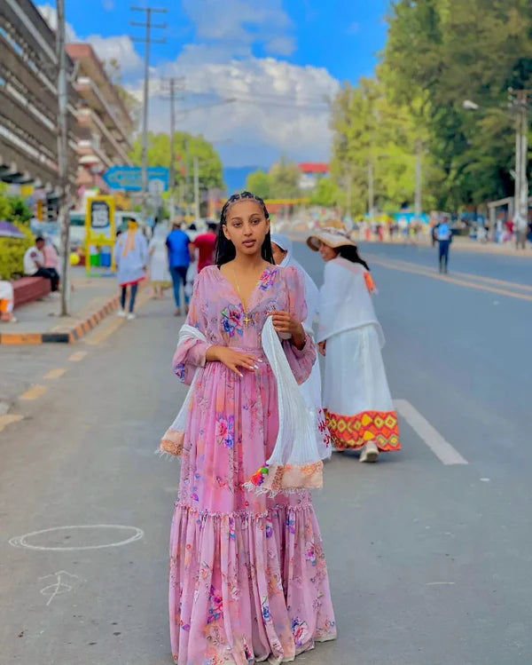 Stunning Sweet Pink Habesha Chiffon Dress: with Colorful Patterns.