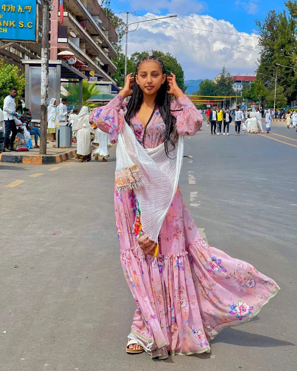 Stunning Sweet Pink Habesha Chiffon Dress: with Colorful Patterns.
