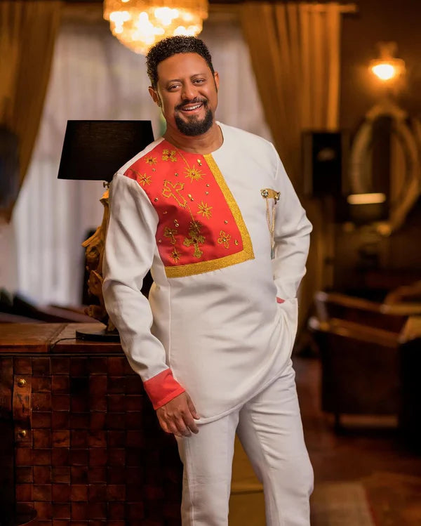 Golden Strands of Heritage: Minimalist Red Habesha Men's Attire in Pisi Fabric.