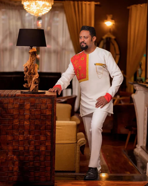 Golden Strands of Heritage: Minimalist Red Habesha Men's Attire in Pisi Fabric.