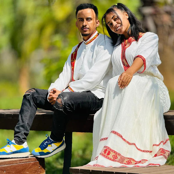 Timeless Unity: Simple Red Menen Habesha Couples' Ensemble.