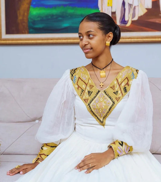 Contemporary Splendor: Modern Elegance in Habesha Couples Wedding Attire.