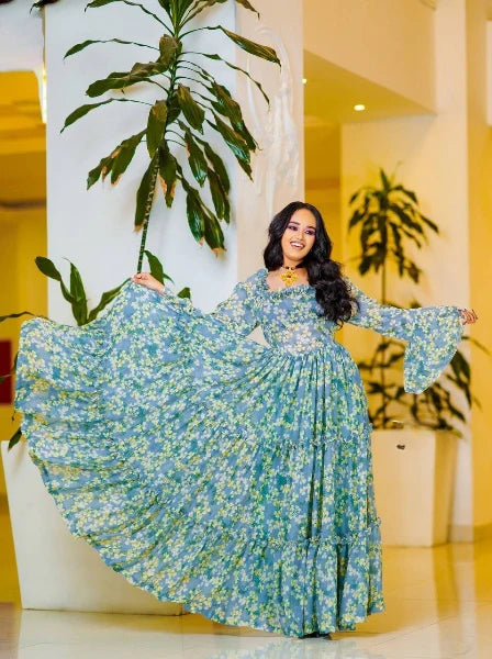 A lovely light blue Habesha chiffon dress with yellow embellishments is perfect for any occasion.