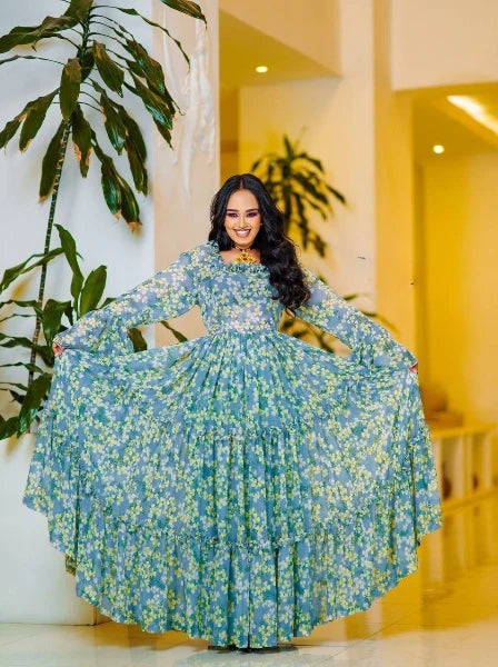 A lovely light blue Habesha chiffon dress with yellow embellishments is perfect for any occasion.