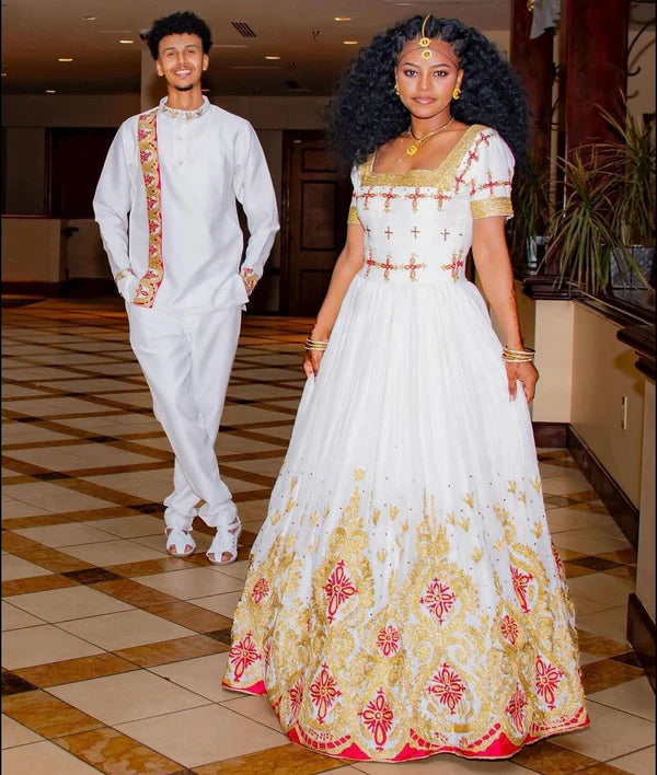 Gorgeous Habesha Couples Outfit: Vibrant Traditional Wedding Attire.