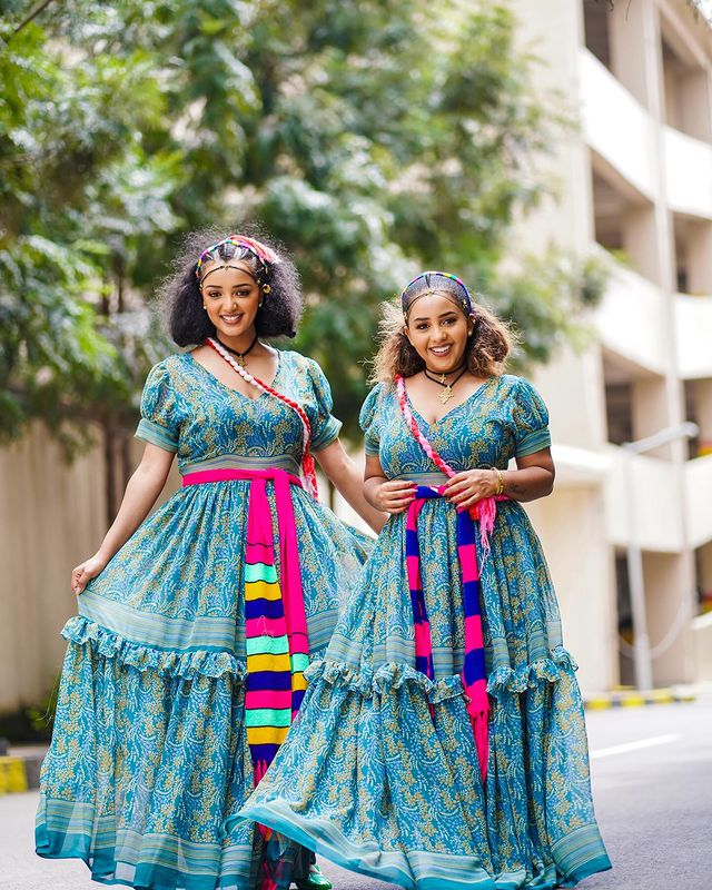 This exquisitely elegant blue Habesha chiffon dress boasts a beautifully flowing silhouette, creating a supremely graceful and stylish ensemble.