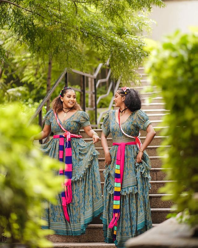 This exquisitely elegant blue Habesha chiffon dress boasts a beautifully flowing silhouette, creating a supremely graceful and stylish ensemble.