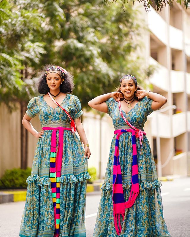 This exquisitely elegant blue Habesha chiffon dress boasts a beautifully flowing silhouette, creating a supremely graceful and stylish ensemble.
