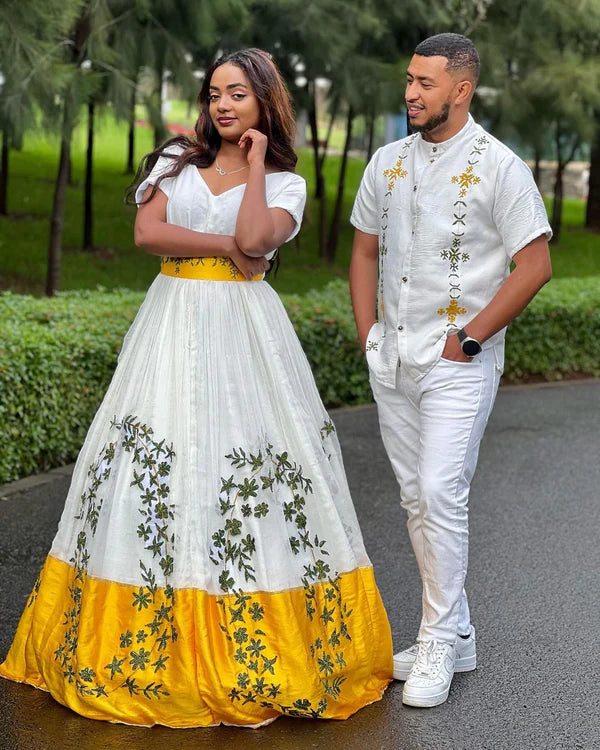 Beautiful Yellow Habesha Couples Outfit Stunning Design with Green Detailing