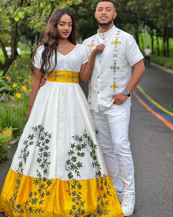 Beautiful Yellow Habesha Couples Outfit Stunning Design with Green Detailing